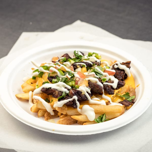 Go Burger's Mexican fries topped with steak, cheese, pico de gallo, and sour cream.